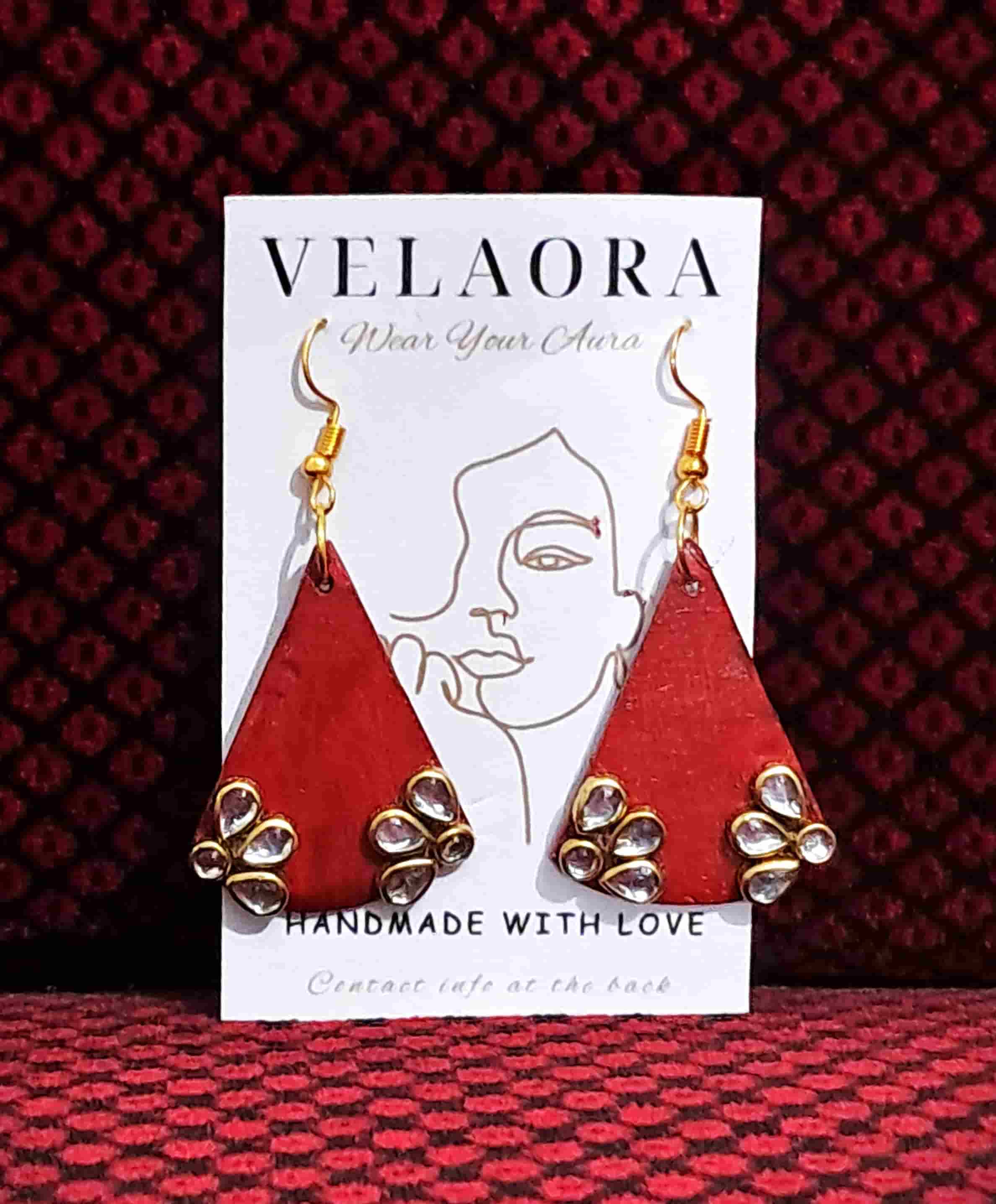 red punch with Kundan work by Velaora Jewels